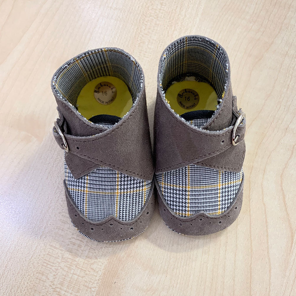 
  Shoes from the Ambarabà children's clothing line, in very soft materials and
  with craftsmans...