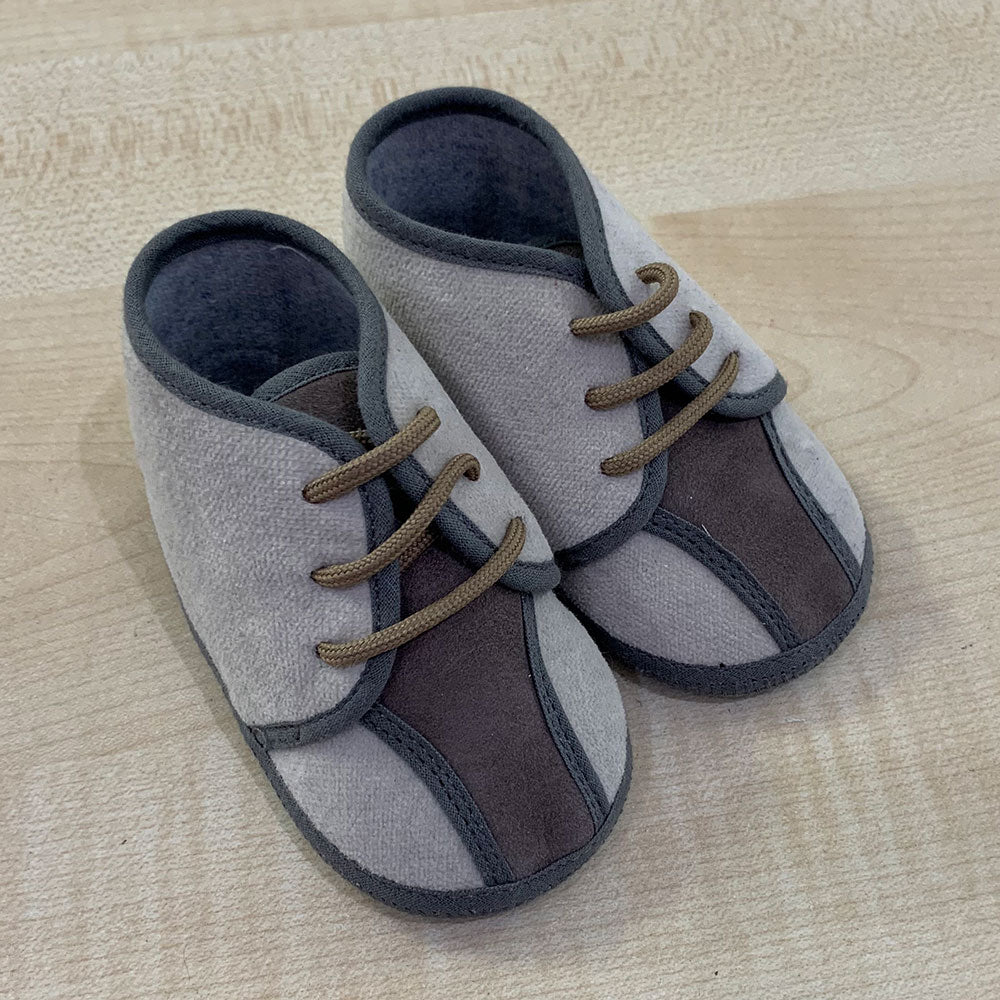 
  Shoes from the Ambarabà children's clothing line, in very soft materials and
  with craftsmans...