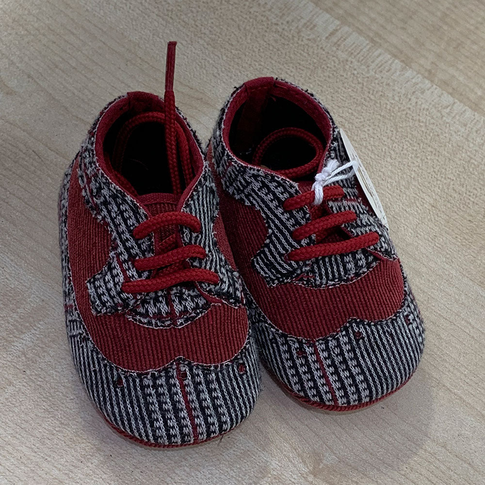 
  Shoes from the Ambarabà children's clothing line, in very soft materials and
  with craftsmans...