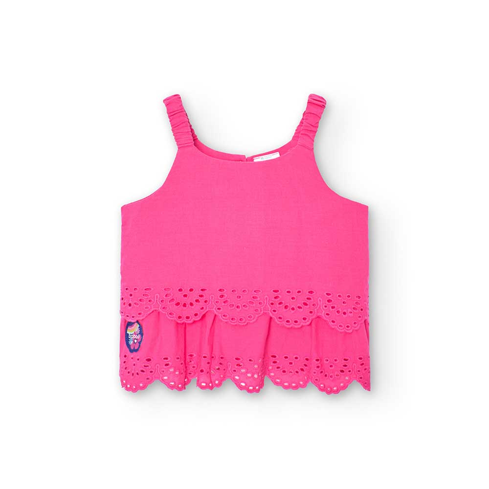 
Top from the Boboli girls' clothing line, with straps and perforated flounces on the bottom.

 
...