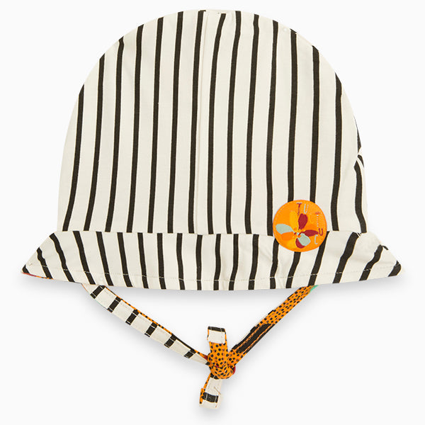 
  Cap from the Tuc Tuc girl's clothing line, with laces under the chin
  and striped pattern, wi...